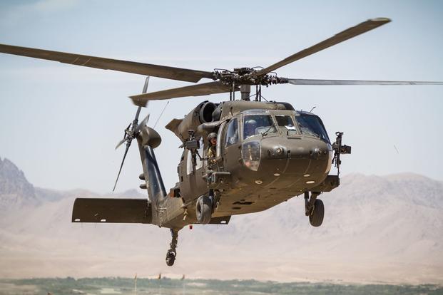 Afghanistan military helicopter crash claims lives of two pilots.